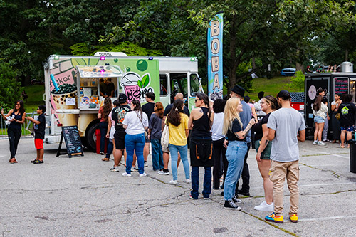 People lined up for a food truck