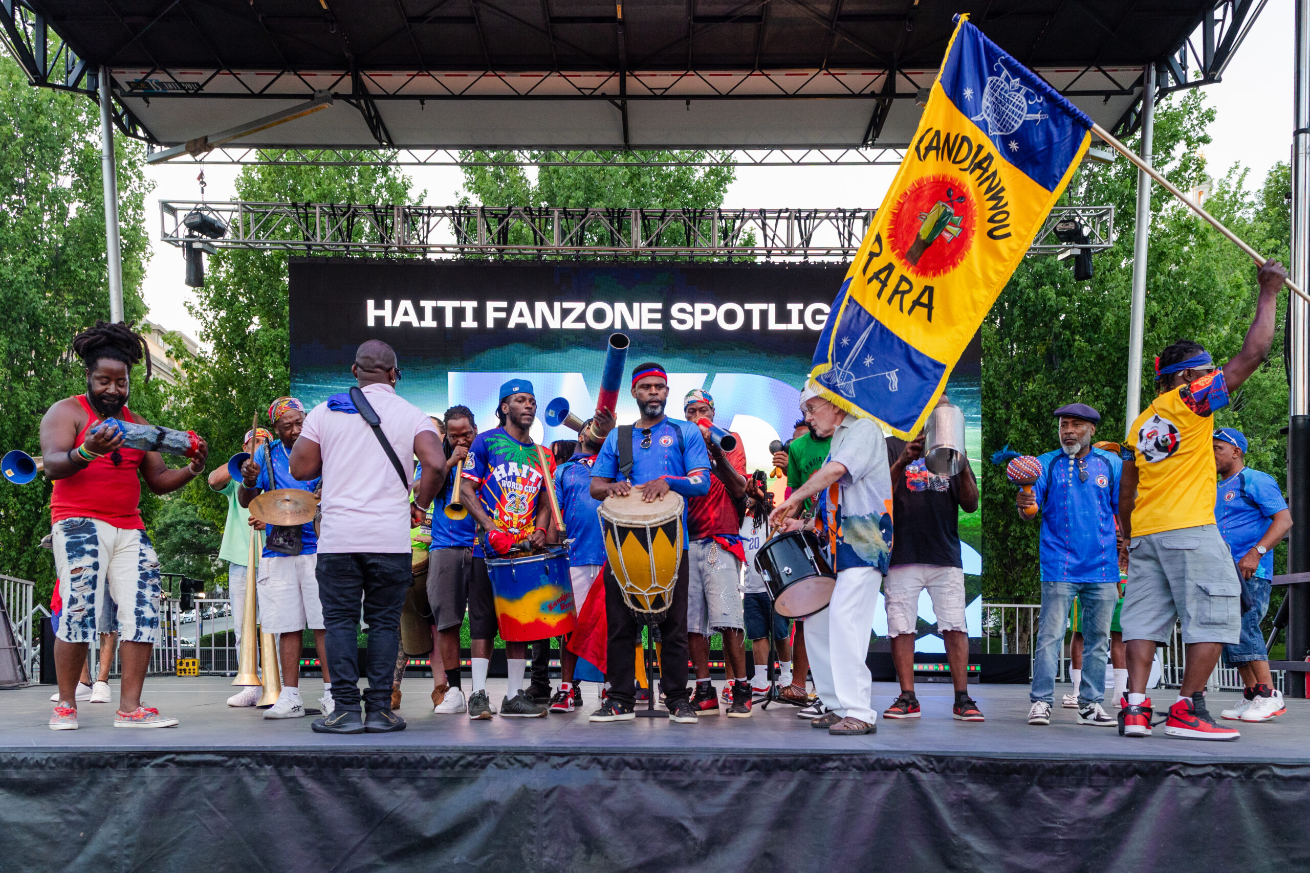 A group of people on stage during the FanZone