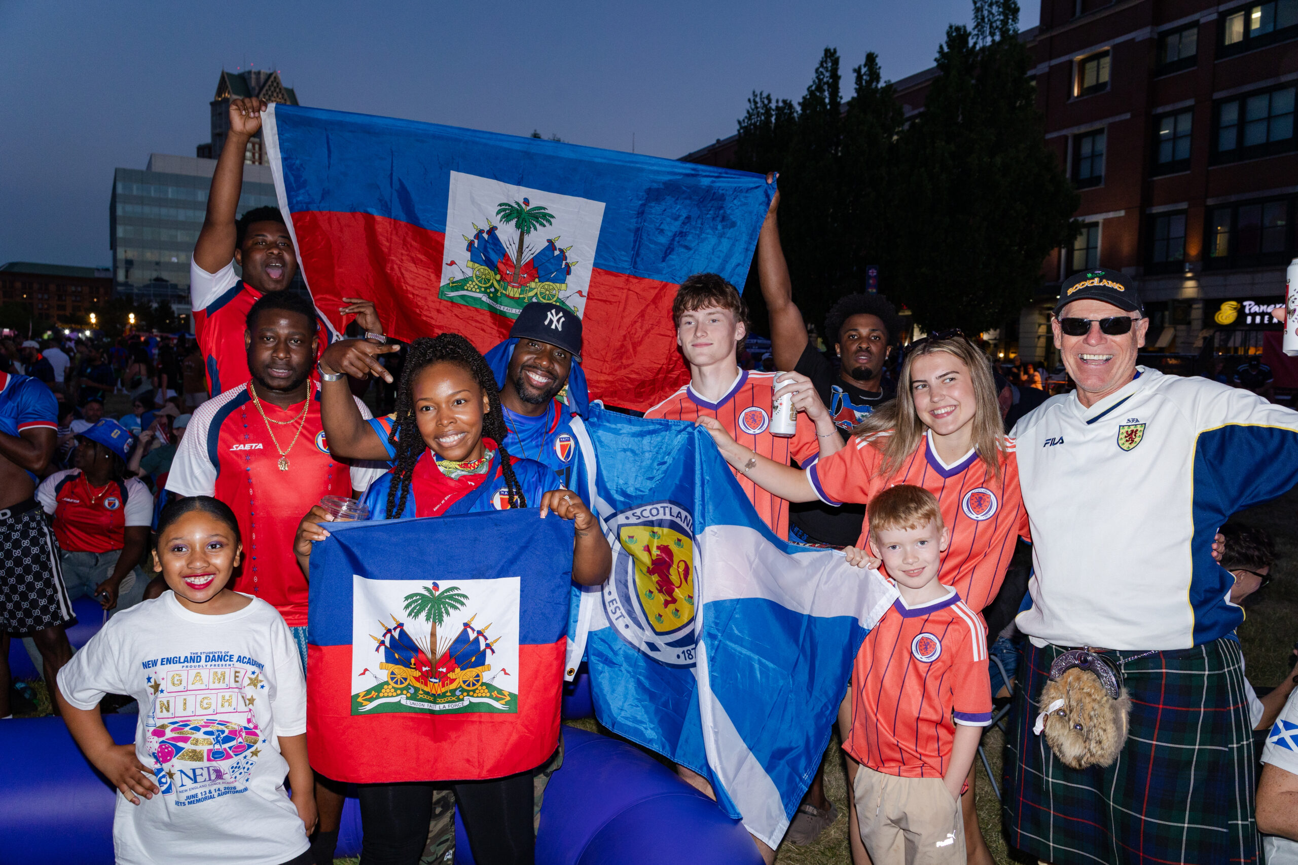 A group of fans celebrating at the PVD FanZone