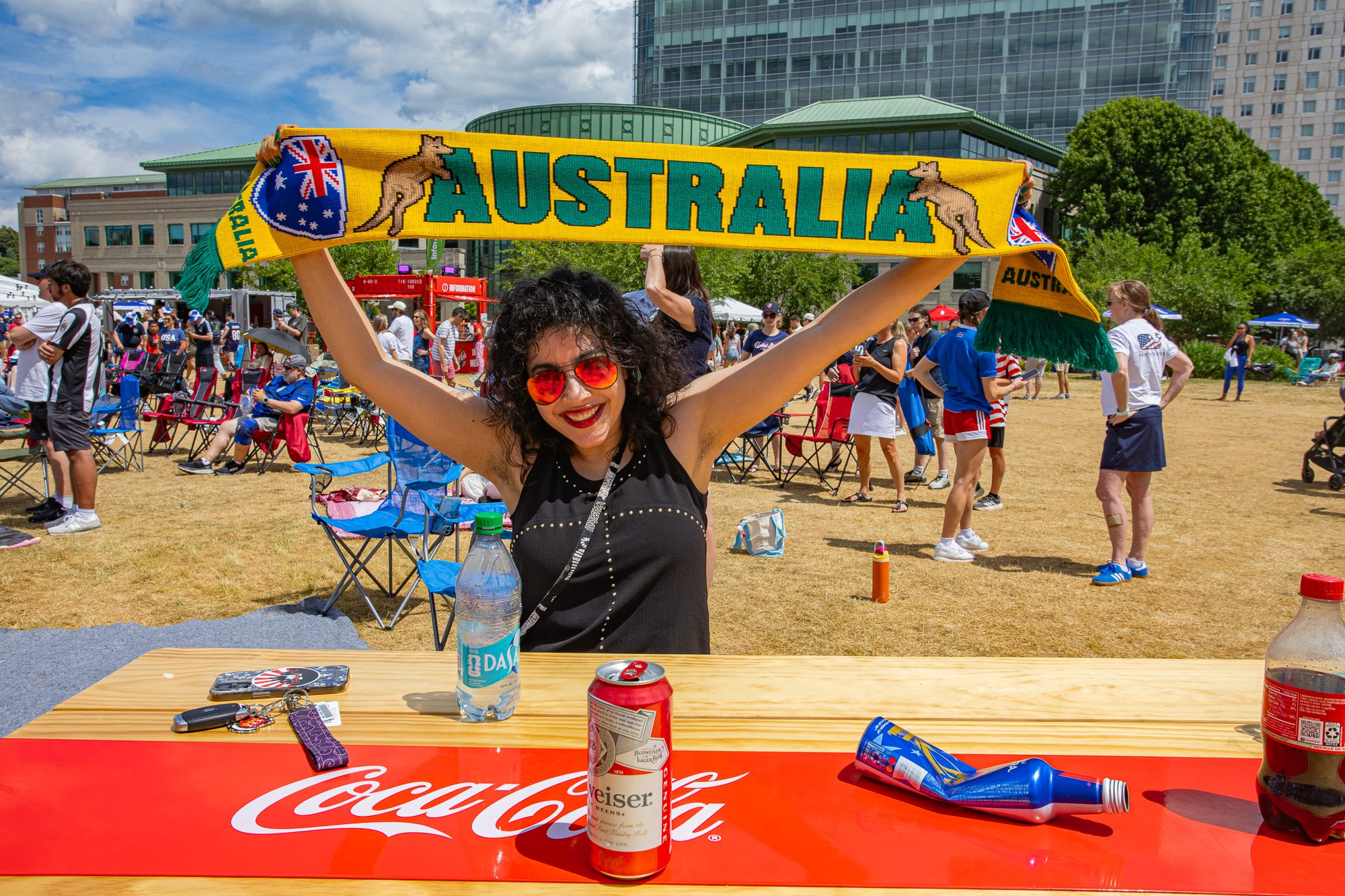 A soccer fan holding up an Australia scarf at the PVD FanZone